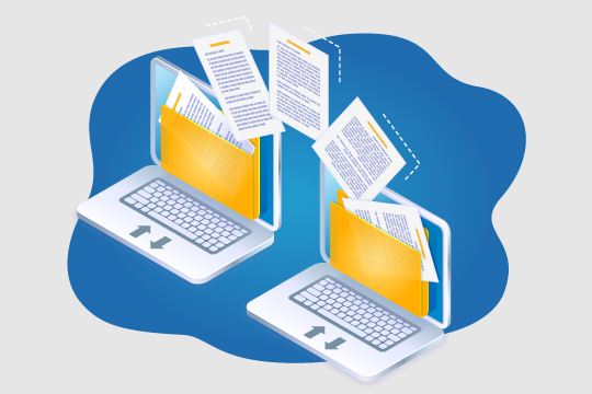 Two laptops showing file transfers being completed