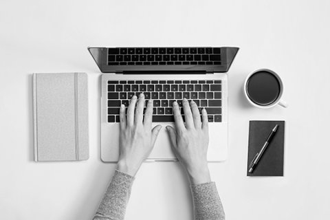 Hands on laptop keyboard