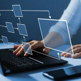 Close up of hands typing on a laptop.