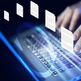  Decorative. Closeup of hands typing on a laptop, using secure file transfer software