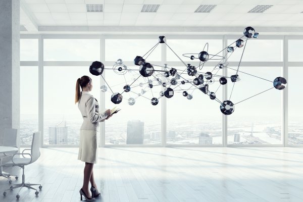woman holding a tablet with a matrix expanding out of it